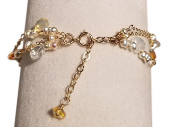 Spring ring closure of multi-strand bracelet